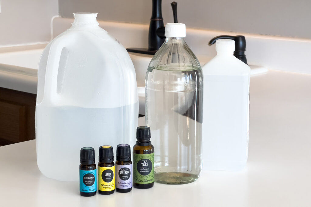water, vinegar, rubbing alcohol, and essential oils, for how to make a multi purpose cleaning spray