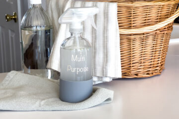 diy multi purpose spray sitting on a cleaning rag in the kitchen