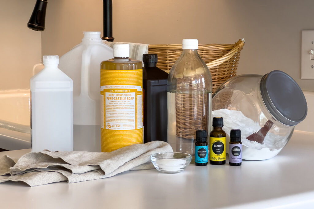 a group of all natural cleaners sits on the kitchen counter