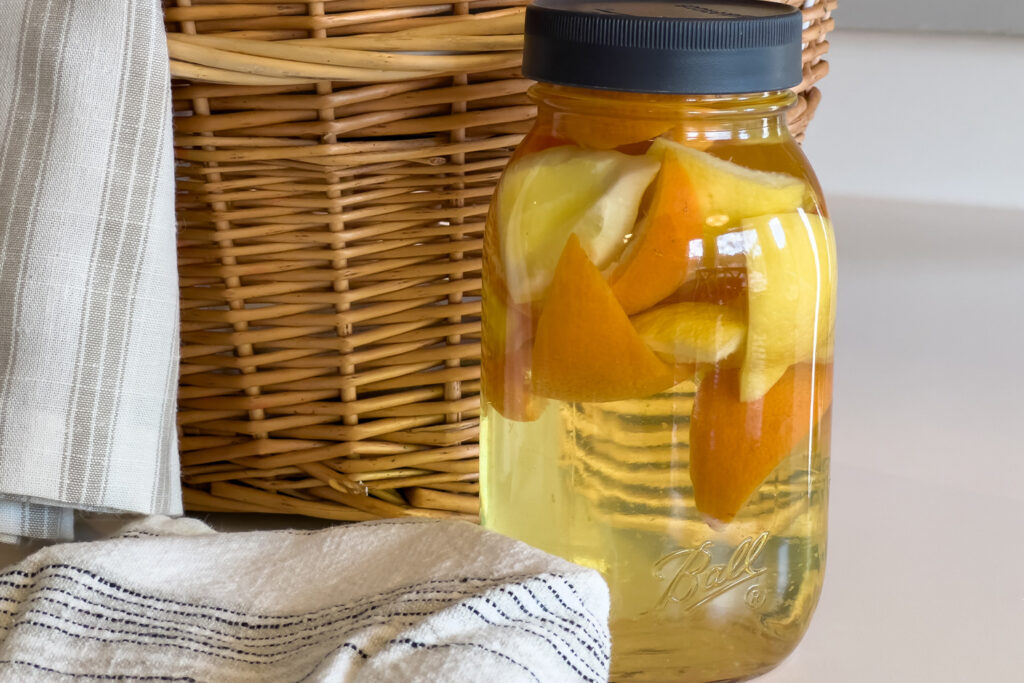 a jar of citrus vinegar sits on the counter