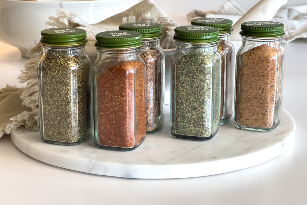 six seasonings from scratch sit next to each other on the kitchen counter