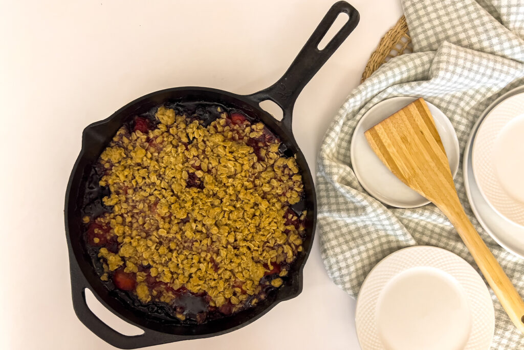 a skillet full of baked lemon berry crumble is sitting on the kitchen counter ready to serve