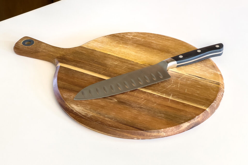 kitchen knife and wood cutting board