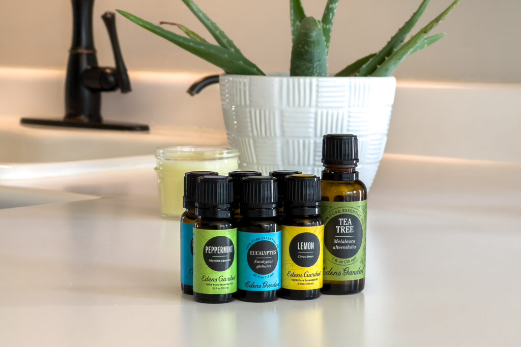 several essential oils sit on the counter
