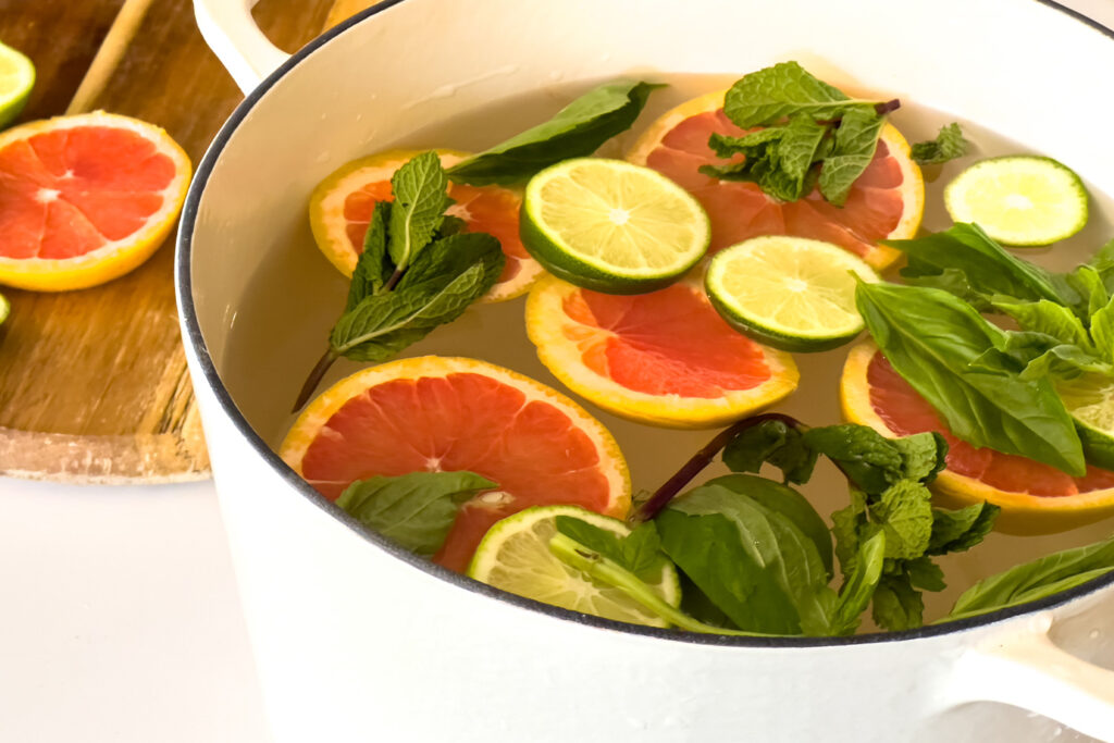 a dutch oven of stovetop potpourris citrus and herbs