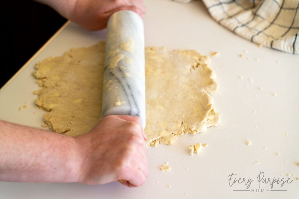 rolling out sourdough pie dough