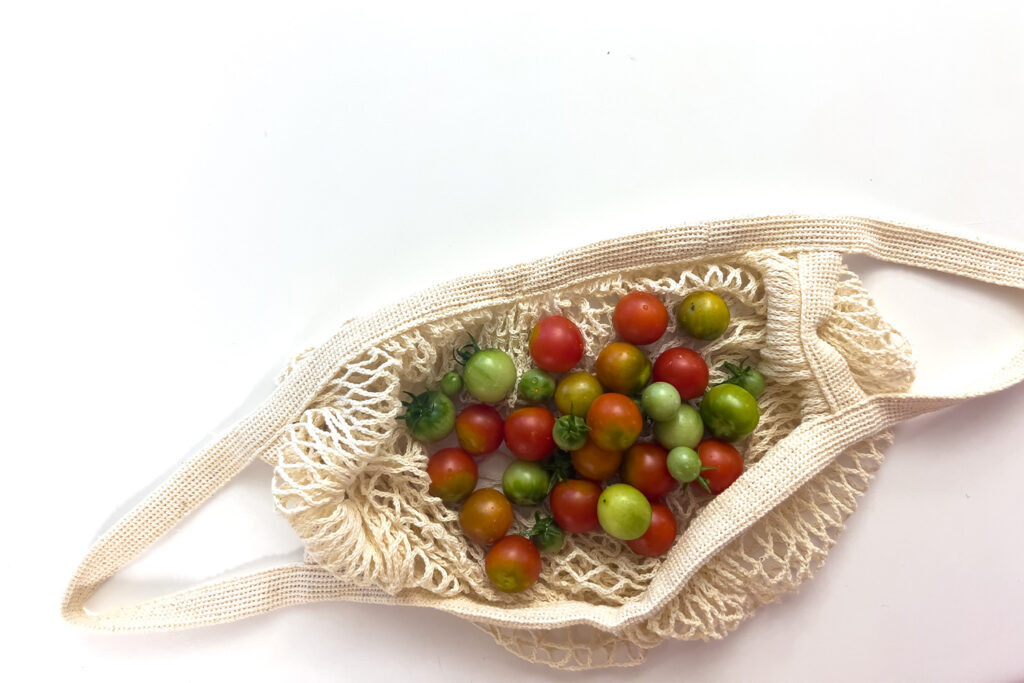 a cloth bag of cherry tomatoes