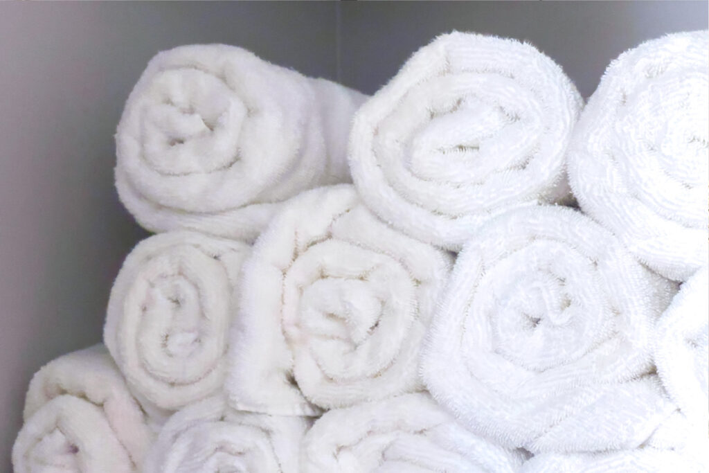 a stack of rolled white towels