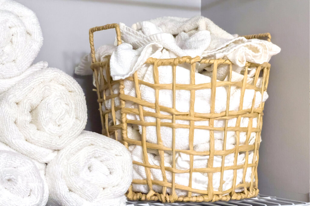 a basket of white washcloths