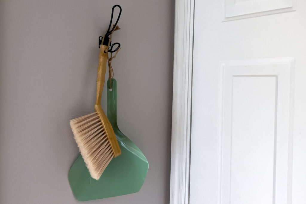 a dustpan and wood broom