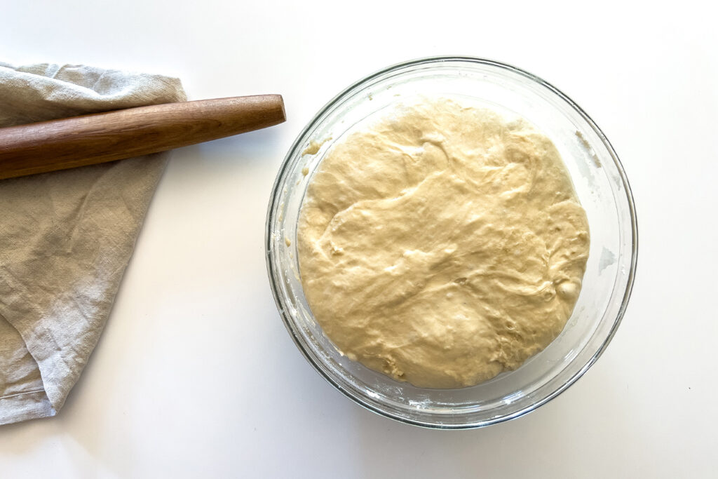 a bowl of dough for sourdough cinnamon rolls