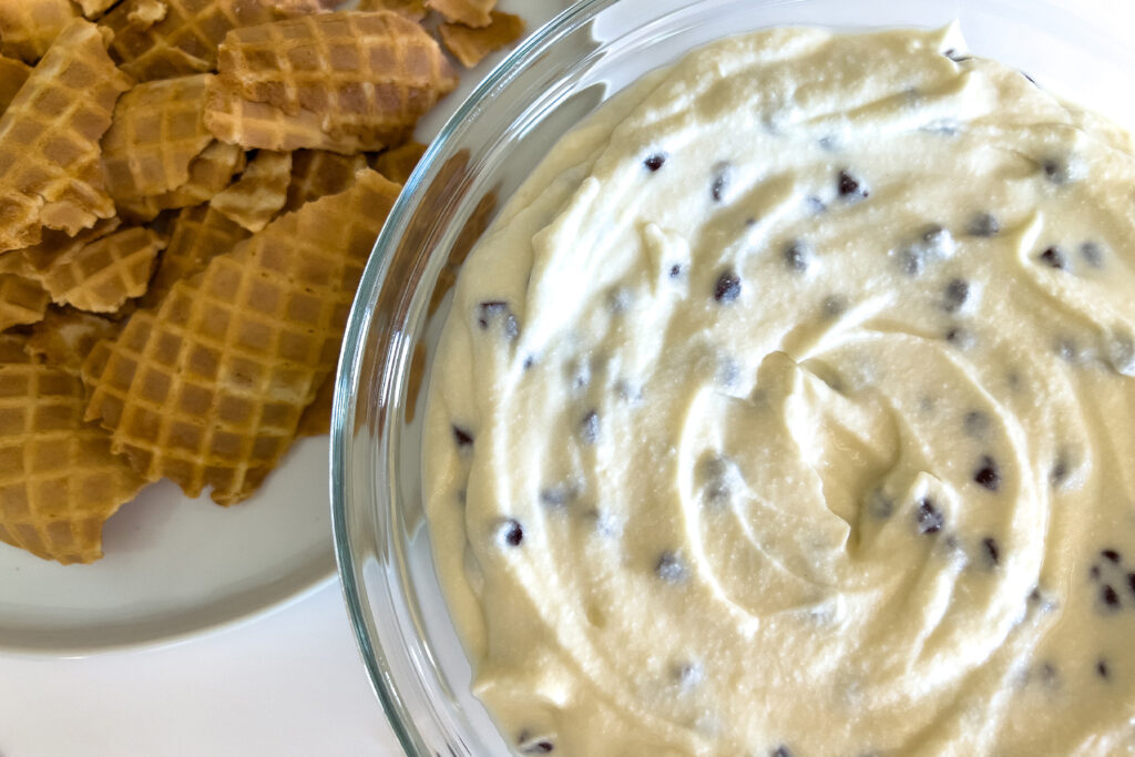 a bowl of easy cannoli dip, with dippers on the side