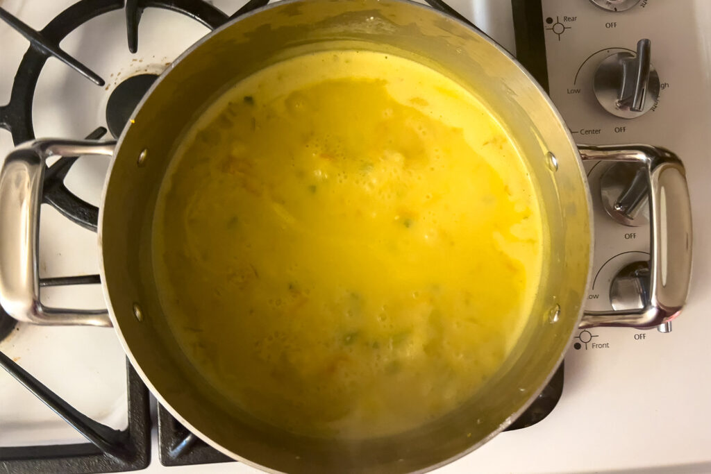 sourdough chicken and dumplings soup coming to a boil