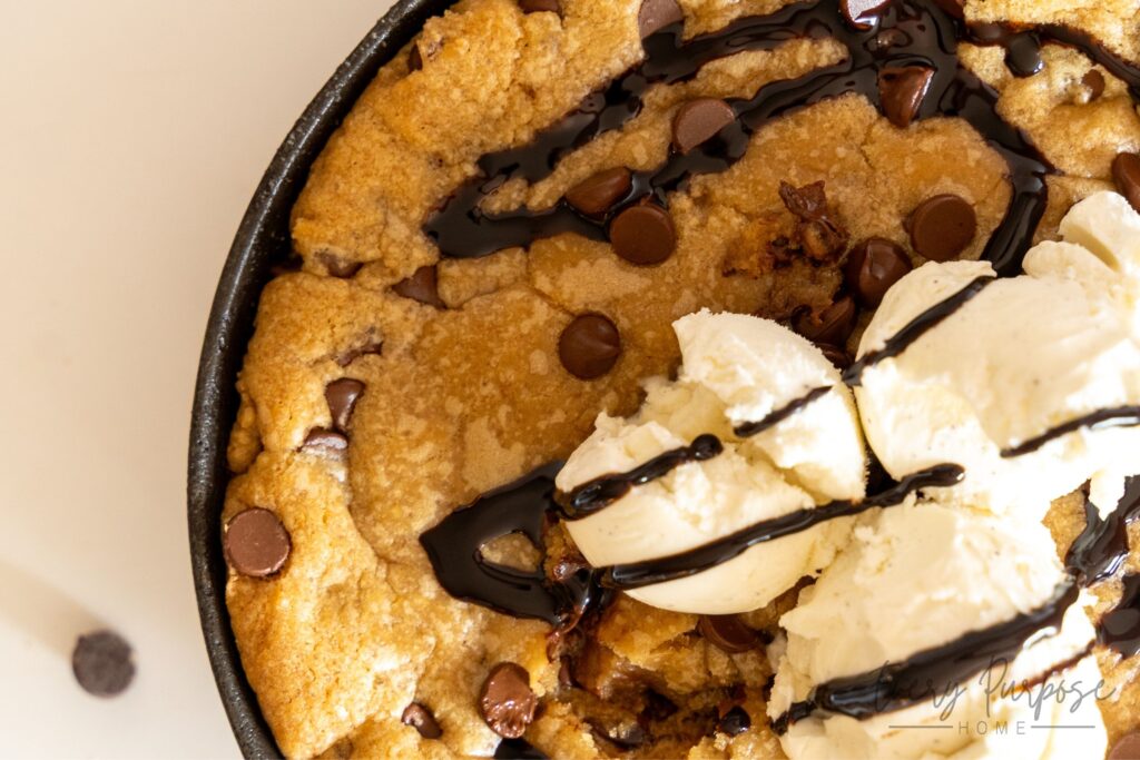 sourdough skillet cookie with chocolate syrup and ice cream