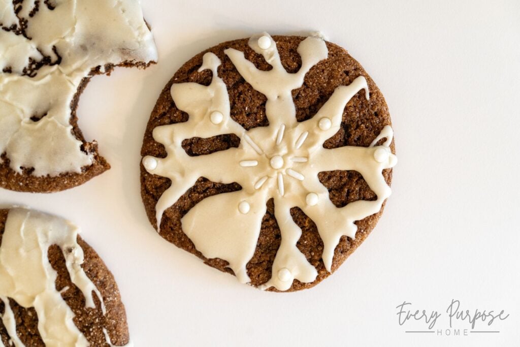 sourdough gingerbread cookies decorated with a snowflake, no rolling pins or cookie cutters needed