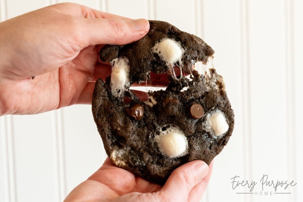 pulling apart melty chocolate marshmallow sourdough cookies with no hot chocolate mix