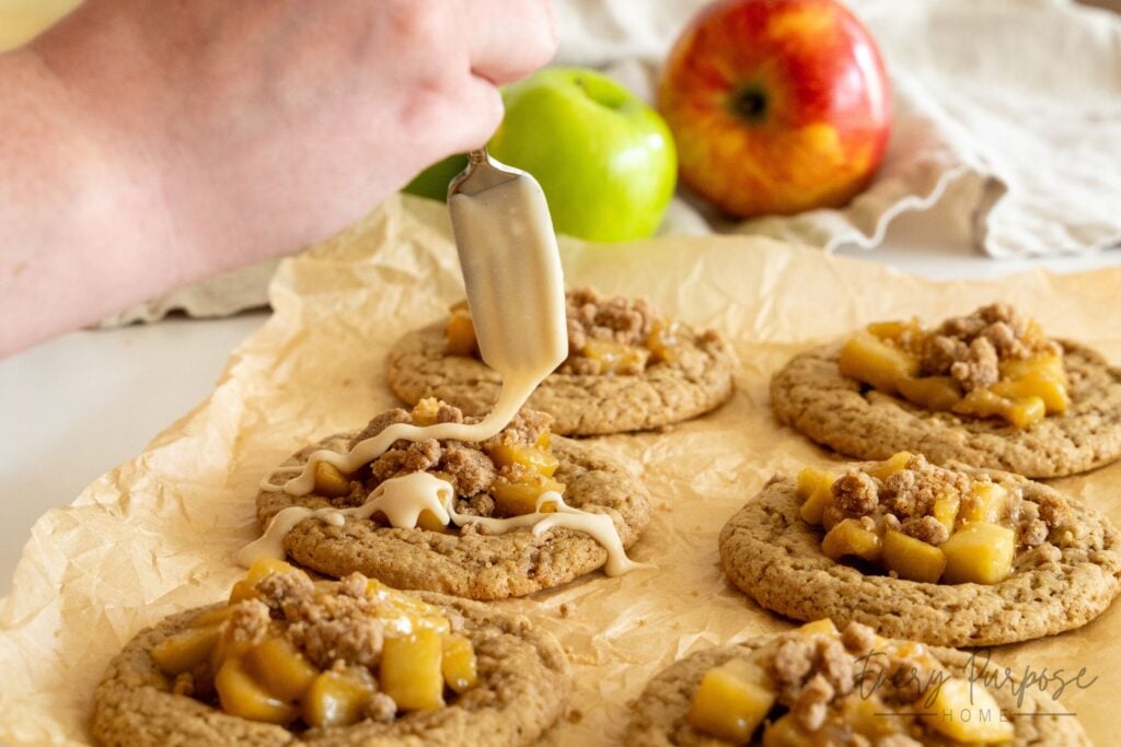 drizzling icing on sourdough apple pie cookies