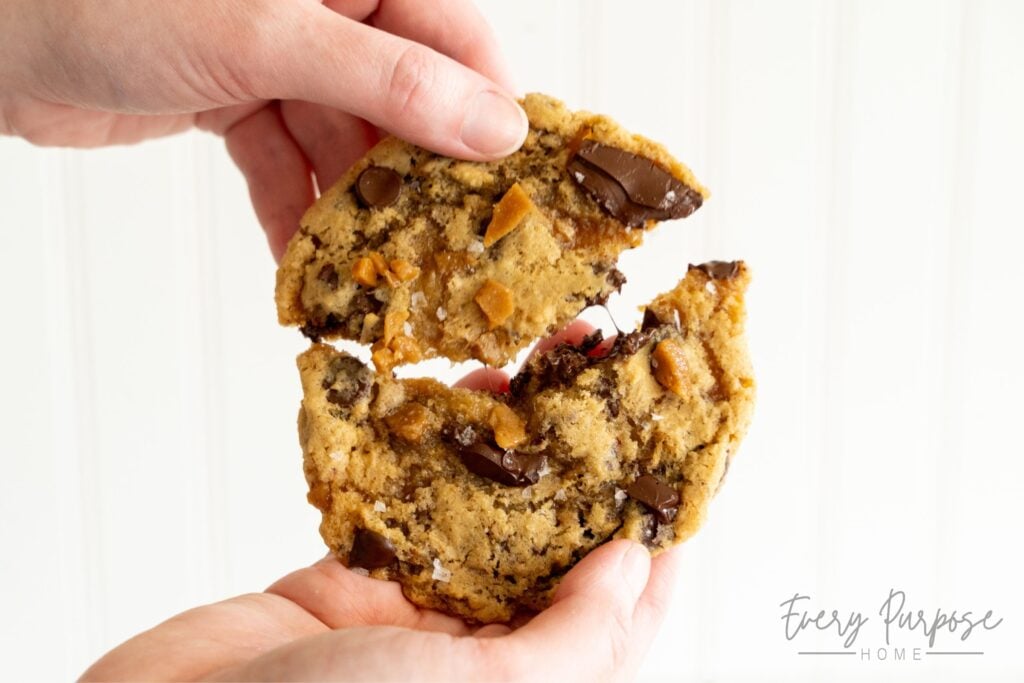 pulling apart sourdough toffee chocolate chip cookies with homemade toffee