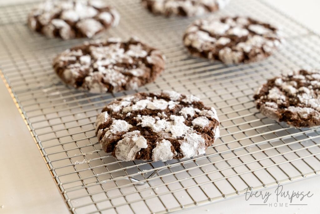 sourdough chocolate crinkle cookies on cooling rack