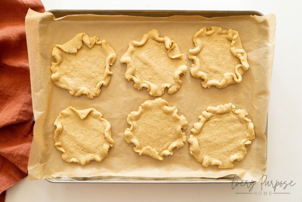 sourdough cookies shaped like pie crusts baked on baking sheet