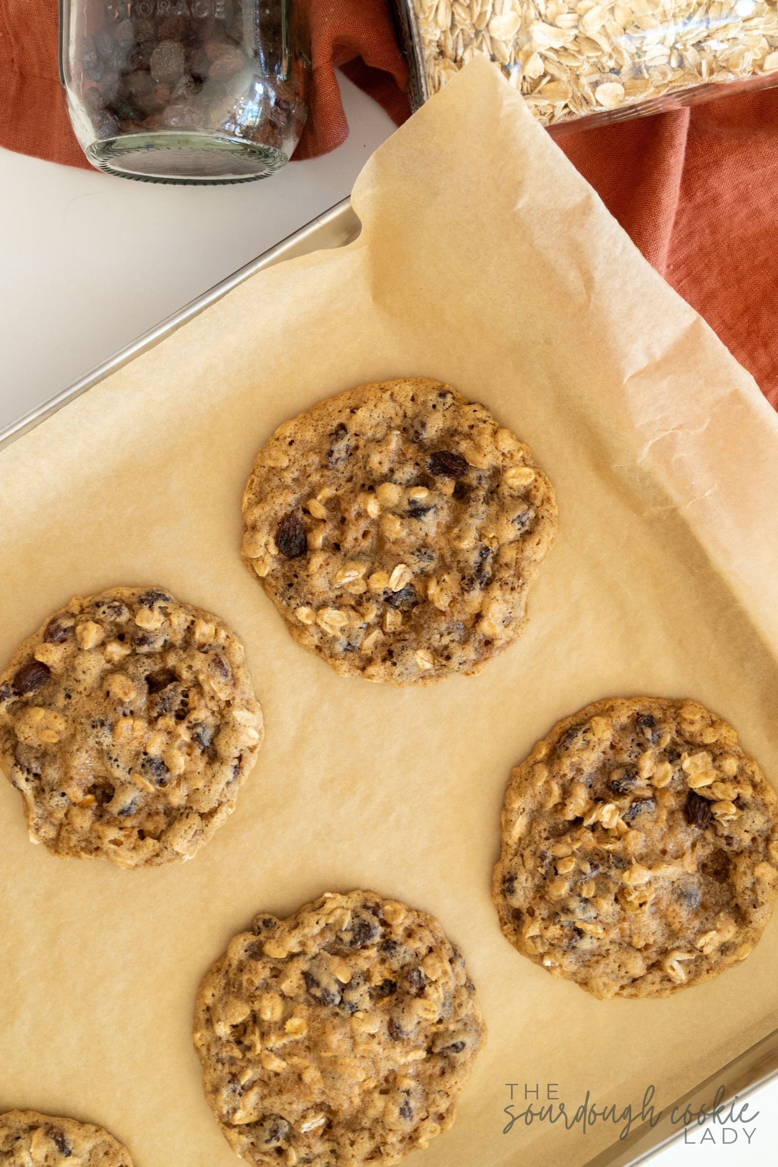 sourdough oatmeal raisin cookies on baking sheet