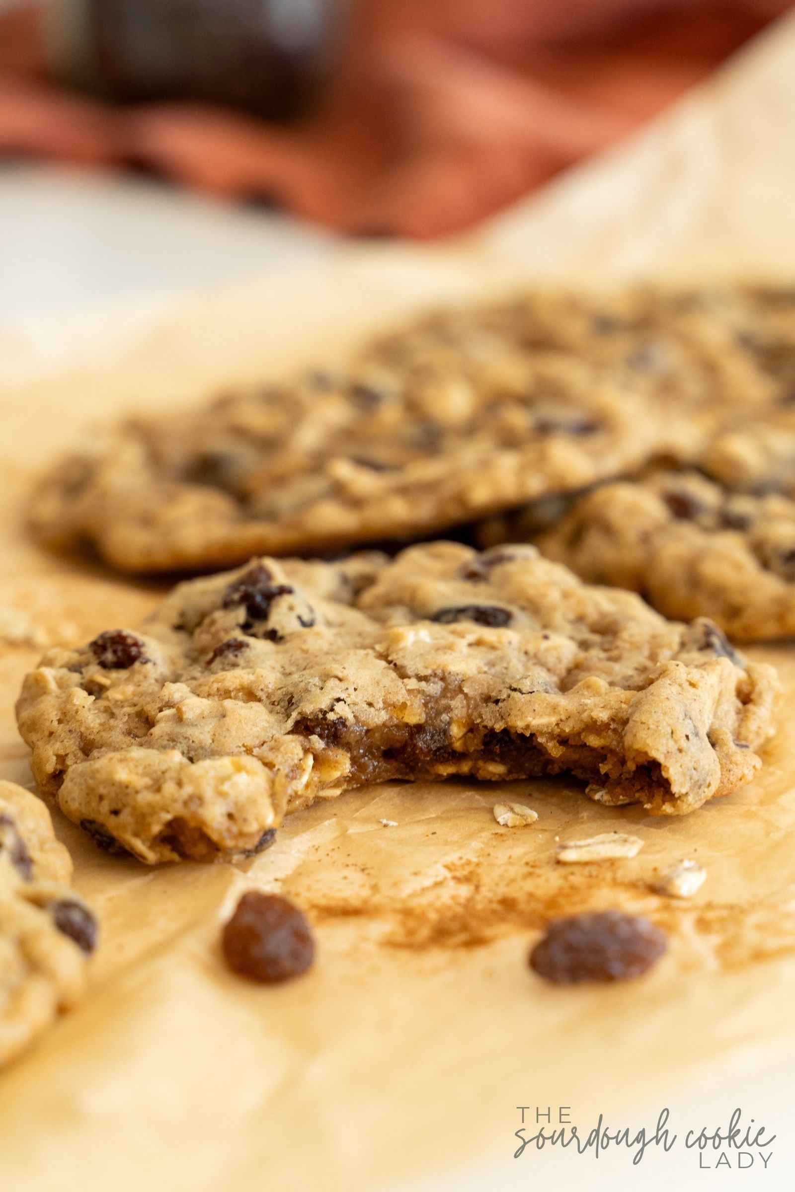 sourdough oatmeal raisin cookies with a bite taken out